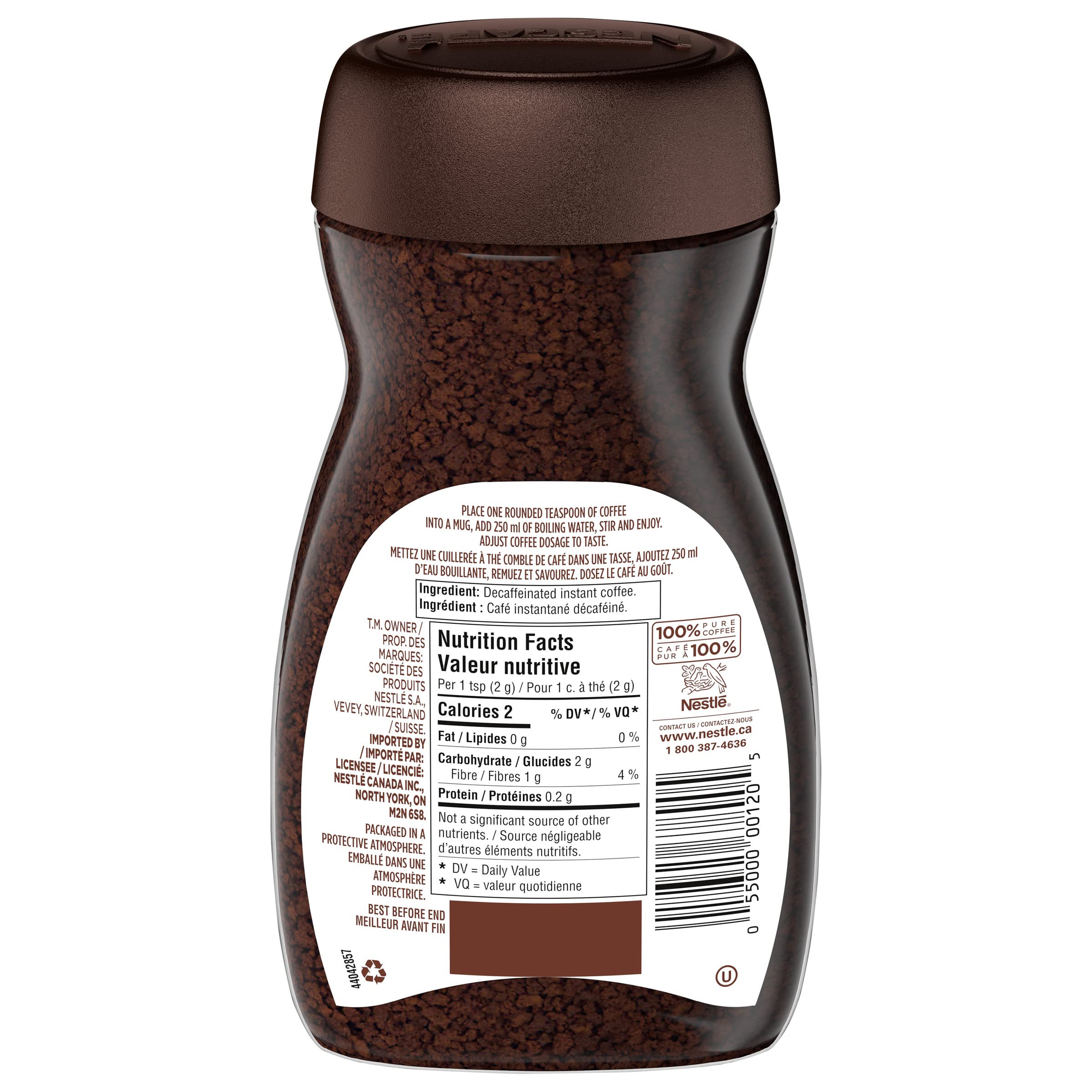 NESCAFÉ Rich Decaf scoop dispensing coffee into cup for instant pleasure.