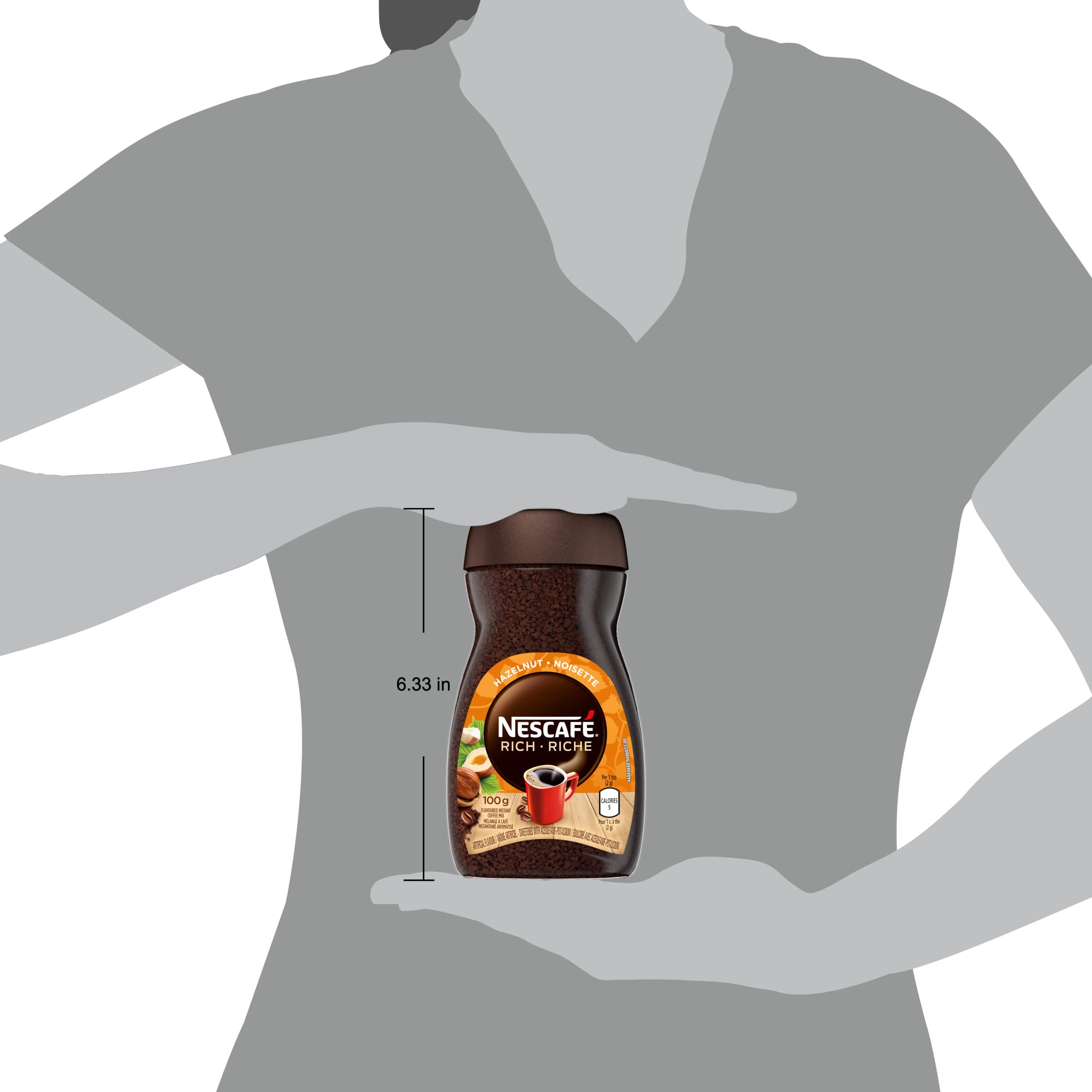 Spoon resting beside NESCAFÉ Rich Hazelnut emphasizes portion control and freshness.