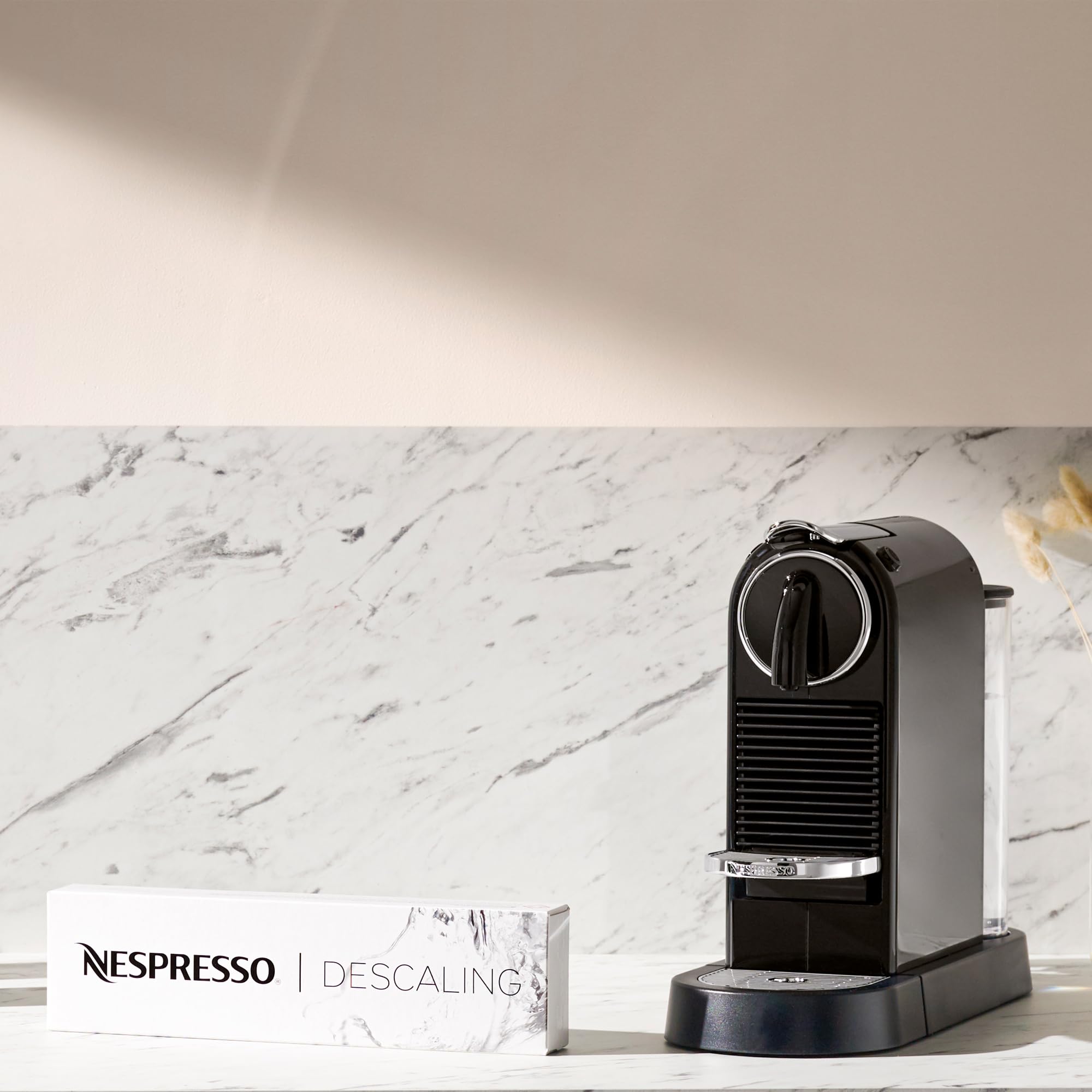 Nespresso descaling process scene illustrating easy coffee taste maintenance