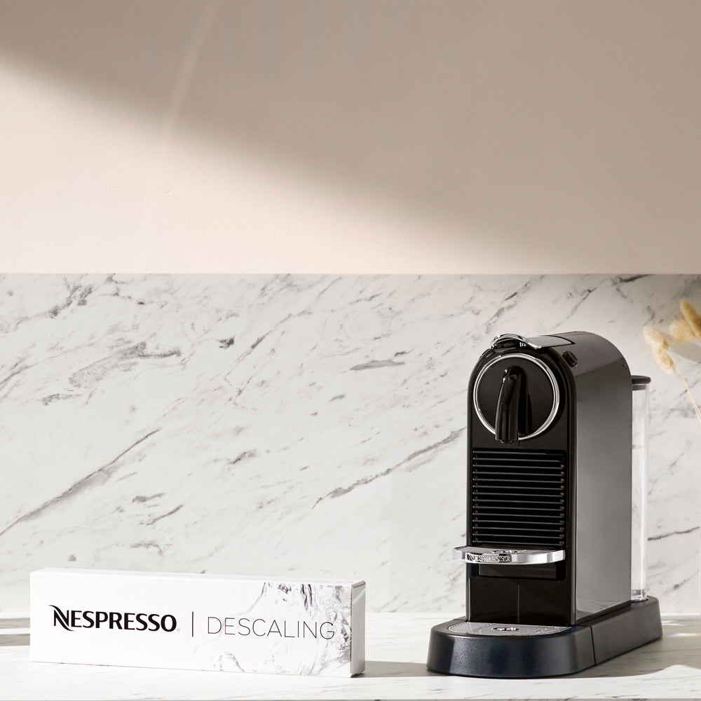 Nespresso descaling process scene illustrating easy coffee taste maintenance