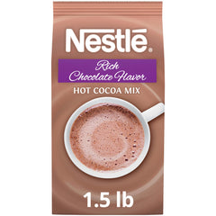 Nestlé Hot Cocoa bulk bag beside a steaming cup, delivering rich chocolate beverages.