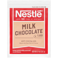 Nestle Hot Cocoa sachets over hot milk, ready to mix quickly.