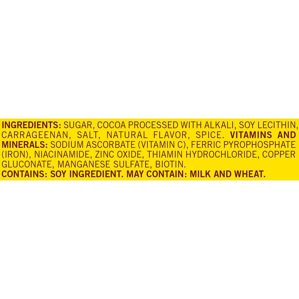 Nesquik powder stirred in milk creates a protein-boosted chocolate beverage.