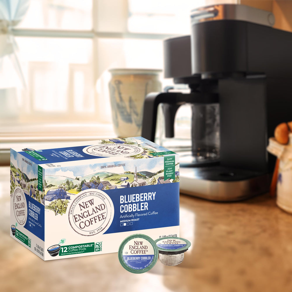 New England Coffee Blueberry Cobbler brewed cup with steam rising aromatically.
