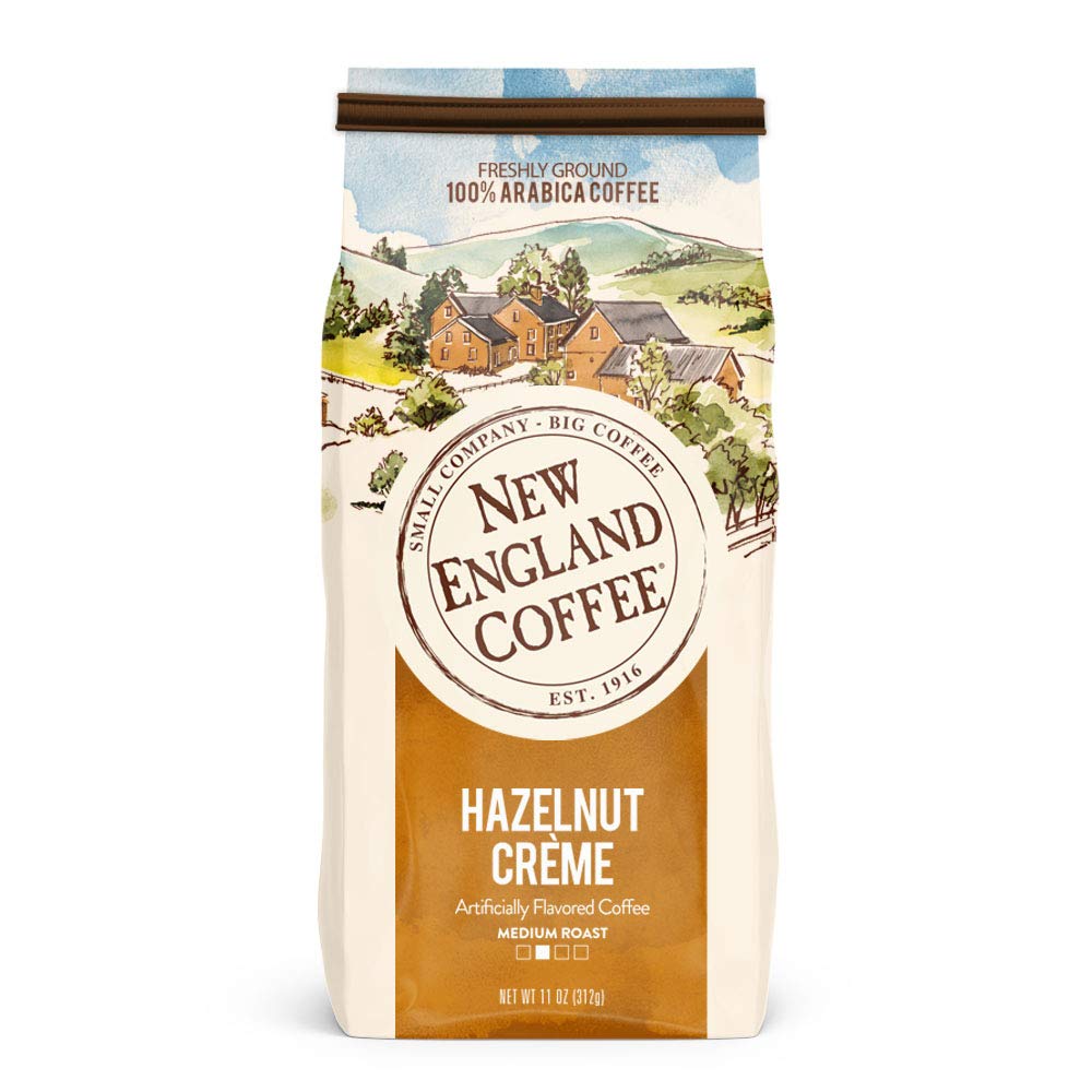 New England Coffee Hazelnut Creme ground coffee 11oz bag front view – smooth, nutty flavor for mornings.