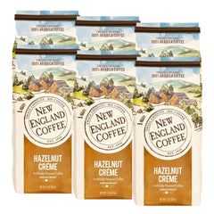 New England Coffee Hazelnut Crème ground coffee front view, 11oz six-pack, inviting aroma
