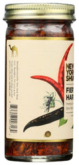 New York Shuk Fiery Harissa powder on a spoon for bold flavor boosts.