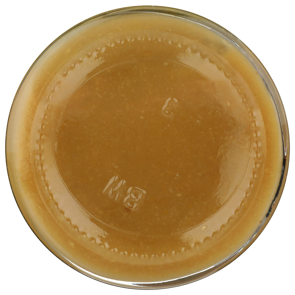 New York Shuk Preserved Lemon Paste closeup reveals textured bits of lemon and spice.