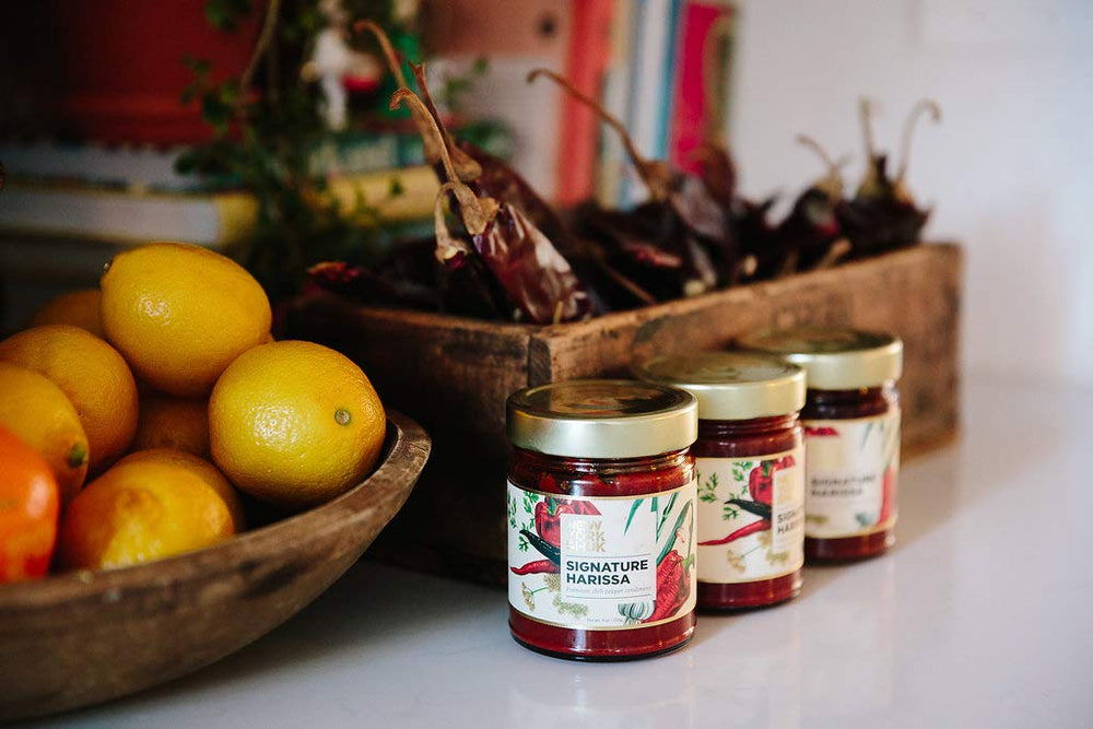 New York Shuk Signature Harissa jar with spoon ready to stir into soups