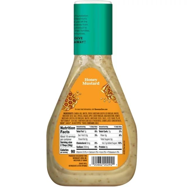 Pouring Newman's Own Honey Mustard Dressing over vegetables for a glaze.