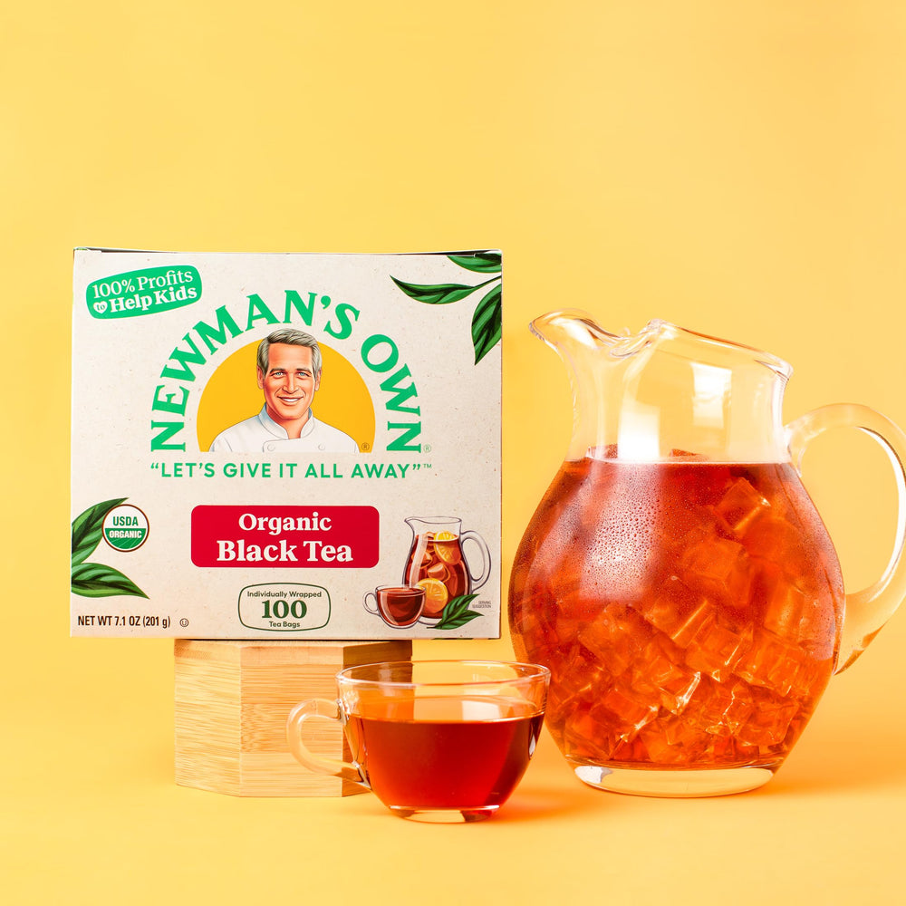 Newman's Own Organics tea bag tag close-up highlights easy steeping reminder.