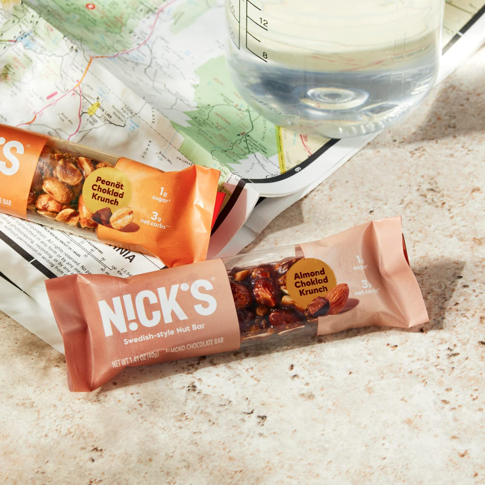 Nick's bar ingredients image with roasted peanuts and chocolate.