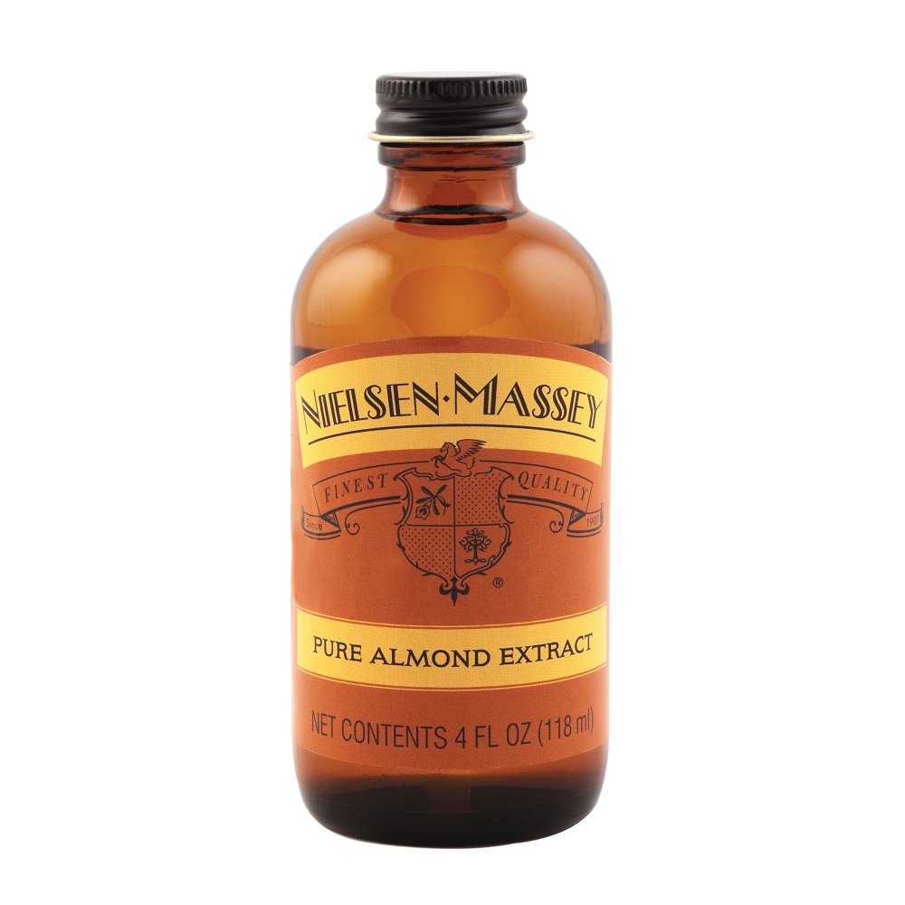 Nielsen-Massey Almond Extract being poured to show craft flavor