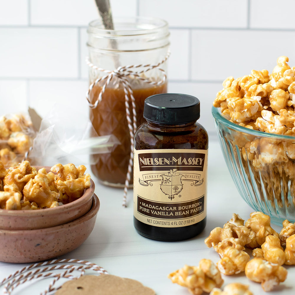Pouring vanilla bean paste into batter to boost flavor and aroma
