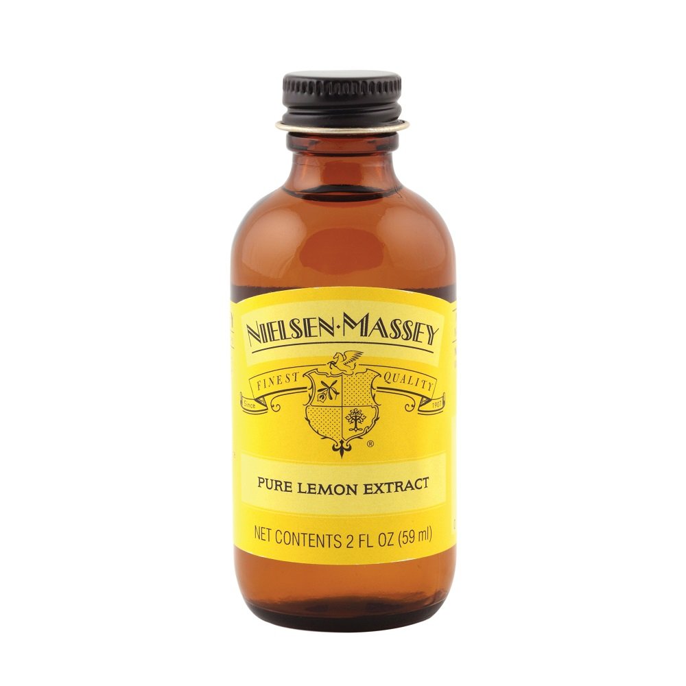 Pouring Nielsen-Massey lemon extract to boost citrus brightness in recipes