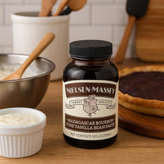 Jar close-up of Nielsen-Massey vanilla bean paste showing real bean specks