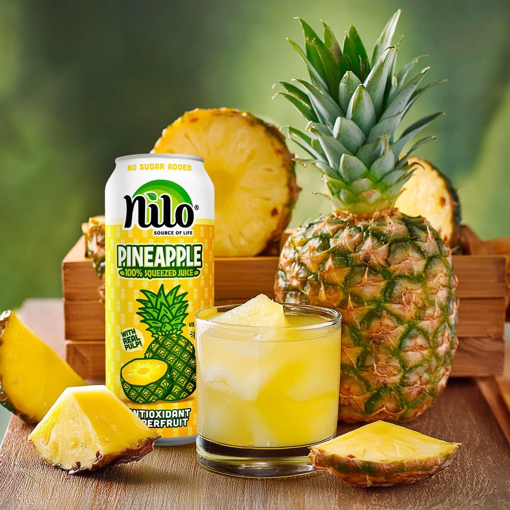 Chilled glass of NILO Pineapple Juice served as a tropical refreshment.