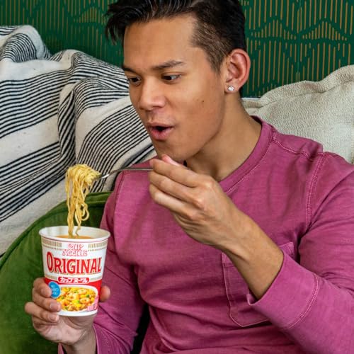 Nissin Cup Noodle Original broth steam close-up highlighting savory aroma and warmth