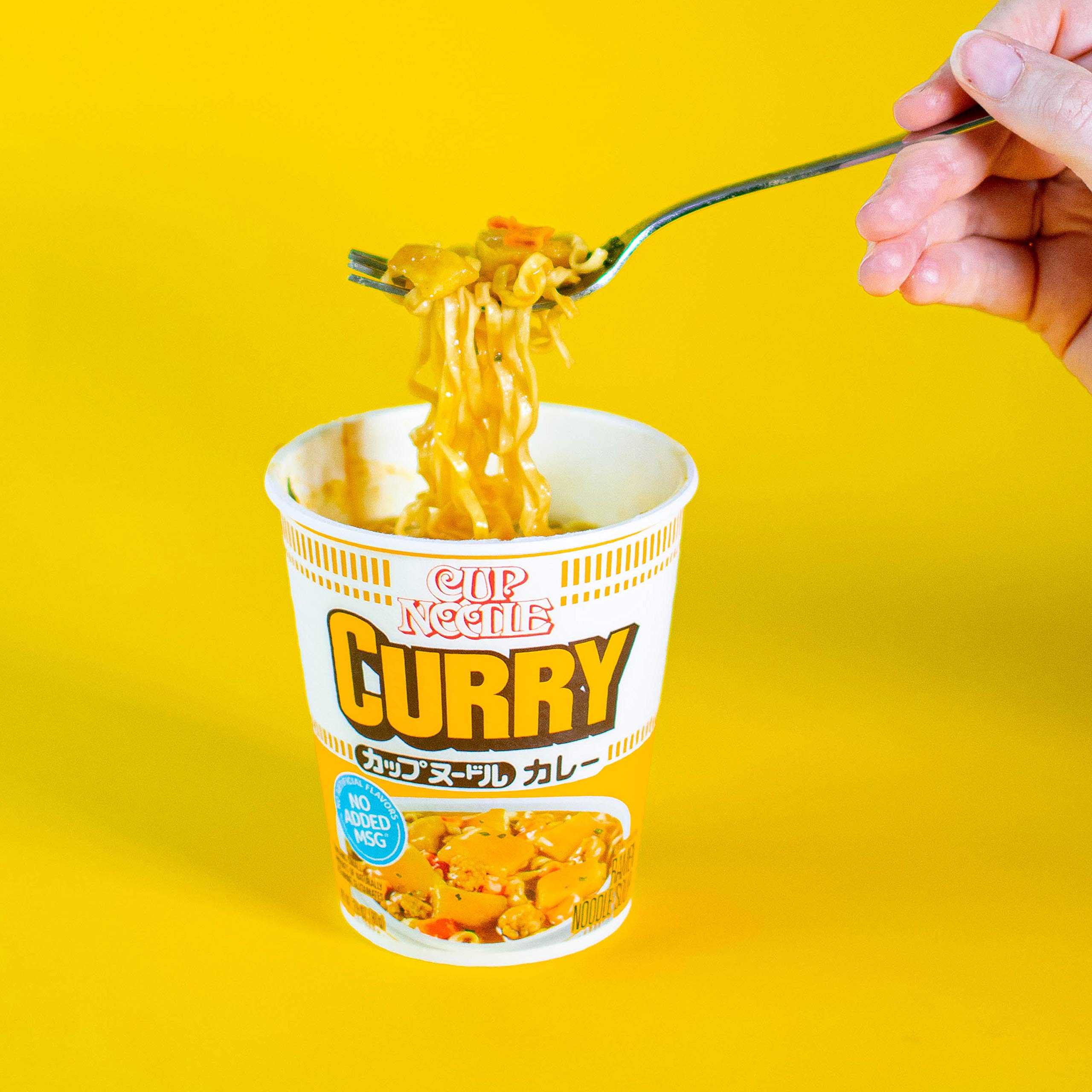 NISSIN Cup Noodles Curry serving with spoon beside, quick dinner option
