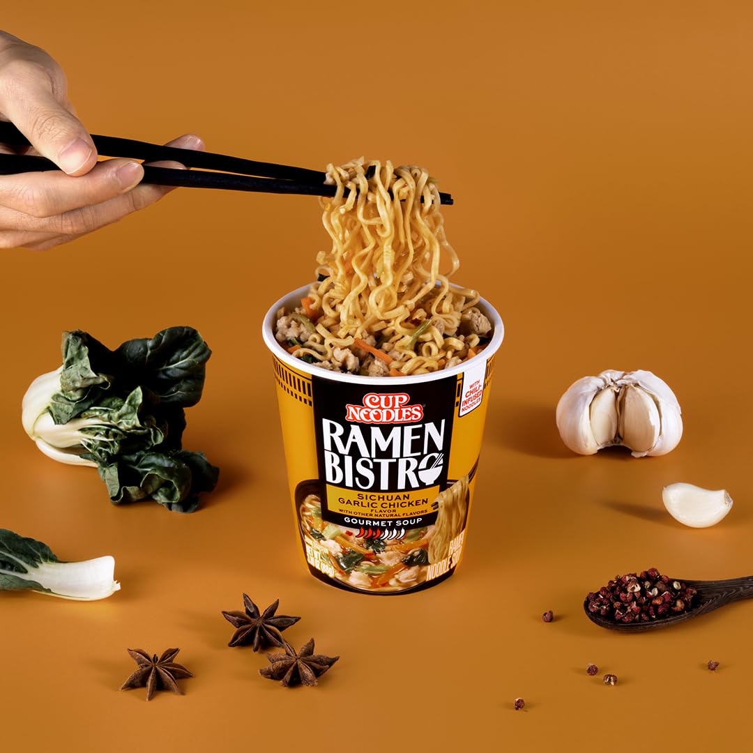 NISSIN Cup Noodles Ramen Bistro bok choy and carrot vegetables in cup.