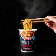 Microwave-ready NISSIN Cup Noodles Stir Fry Teriyaki Beef noodles close-up.