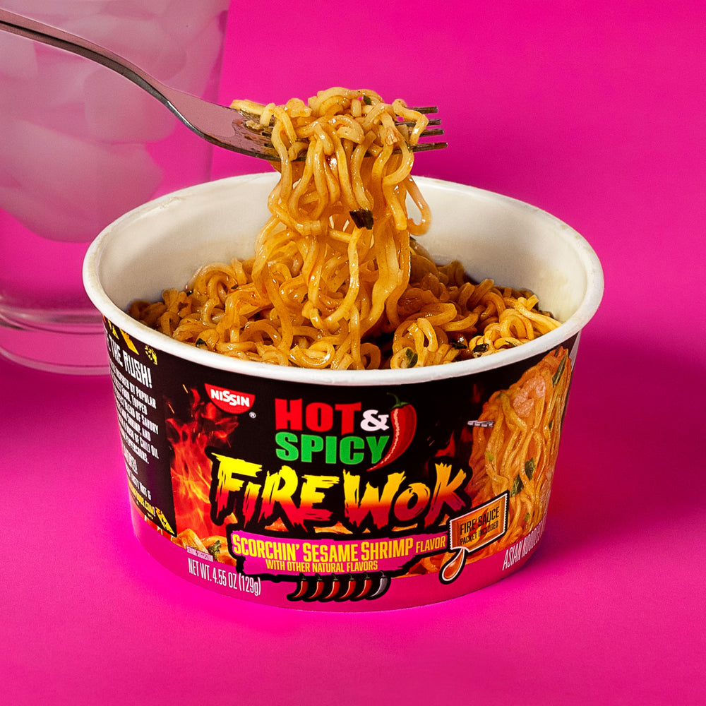 NISSIN Fire Sauce Packet opens to unleash a spicy kick.