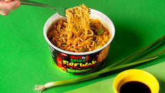 NISSIN Hot & Spicy Fire Wok pork broth base close-up for hearty satisfaction.