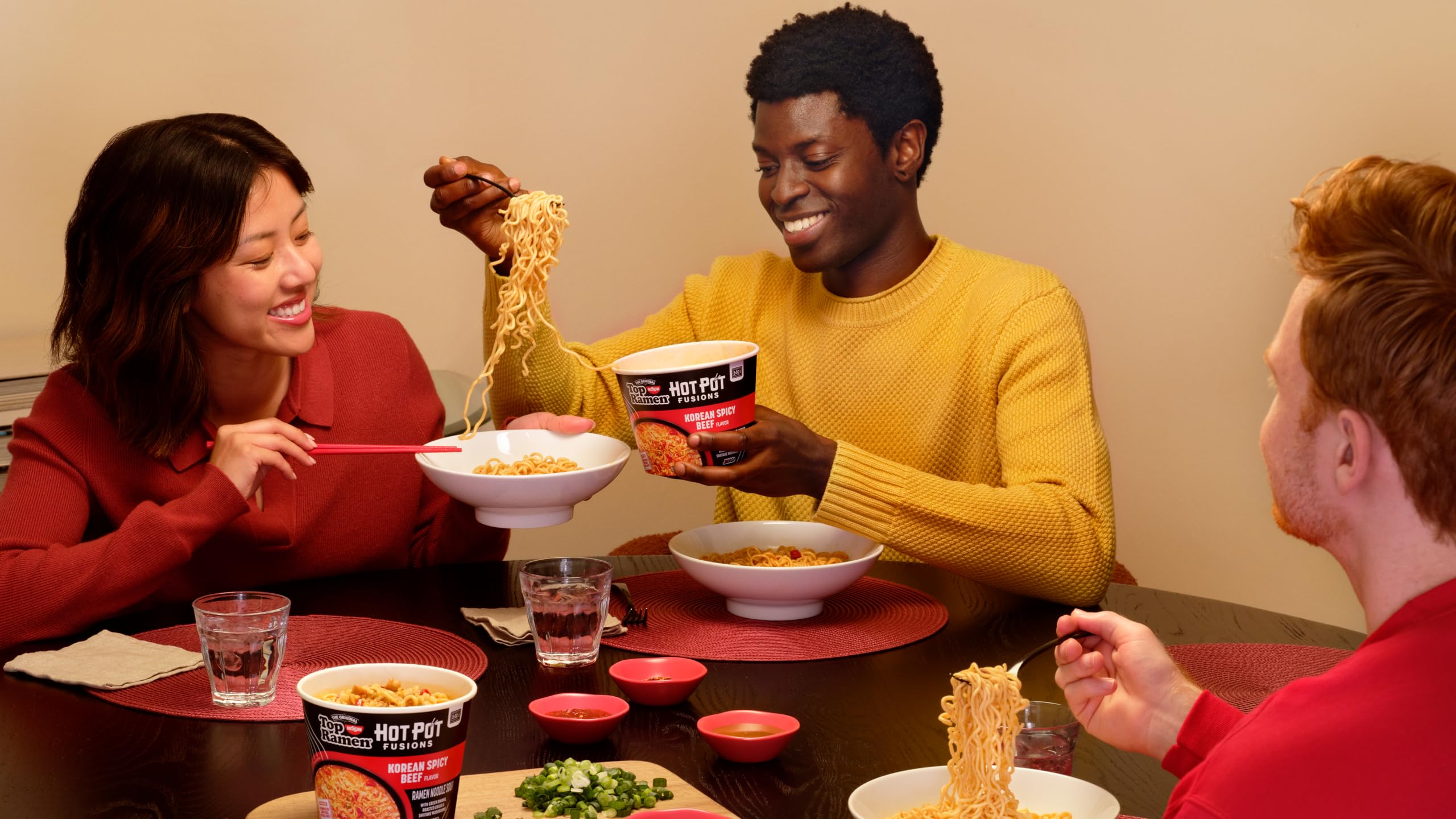 NISSIN Top Ramen HotPot Fusions Korean Spicy Beef family dining scene, ideal for sharing.