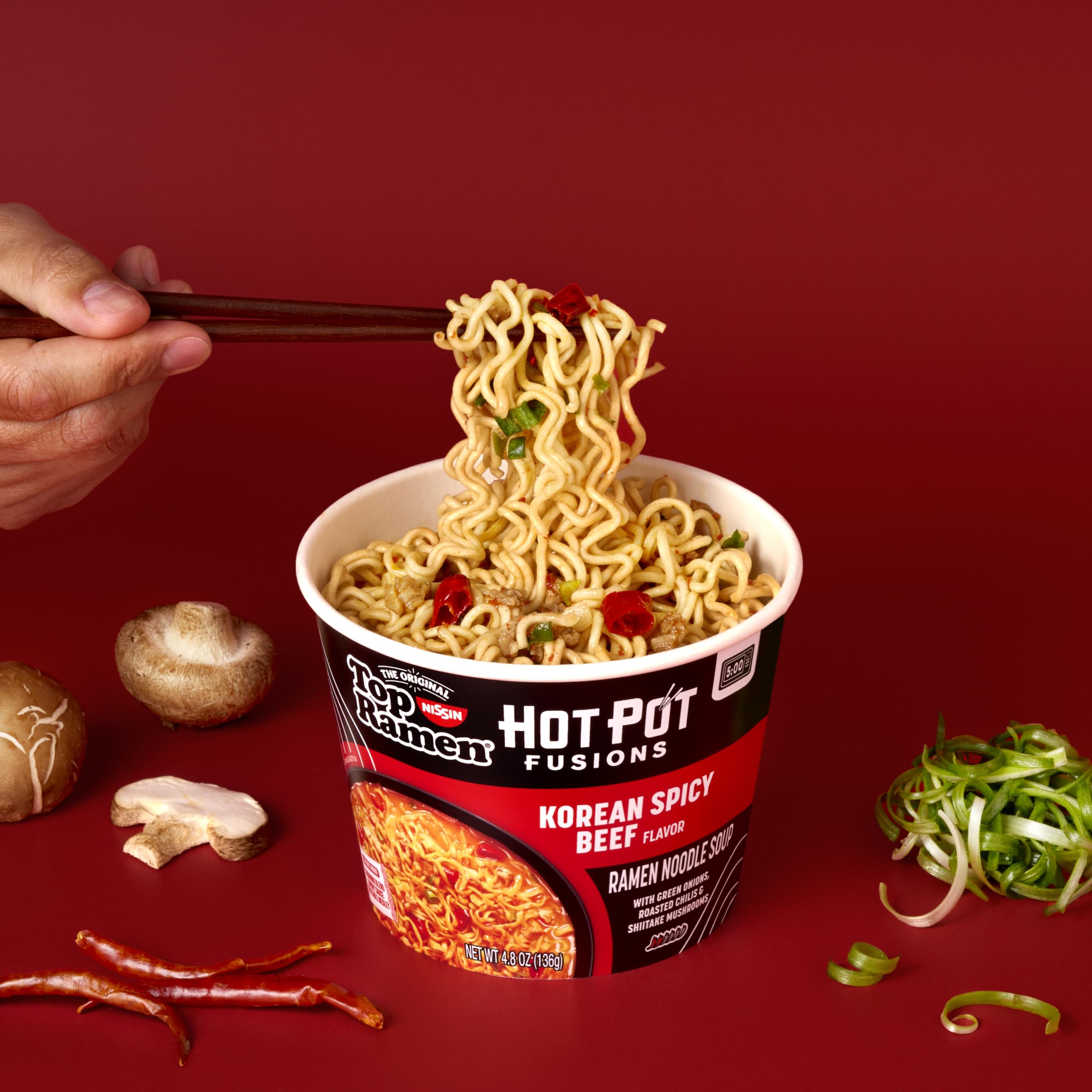 NISSIN Top Ramen HotPot Fusions Korean Spicy Beef microwave-ready bowl steaming.