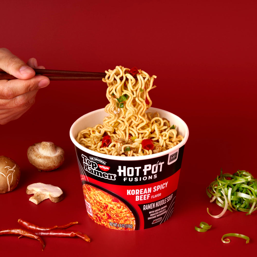 NISSIN Top Ramen HotPot Fusions Korean Spicy Beef microwave-ready bowl steaming.