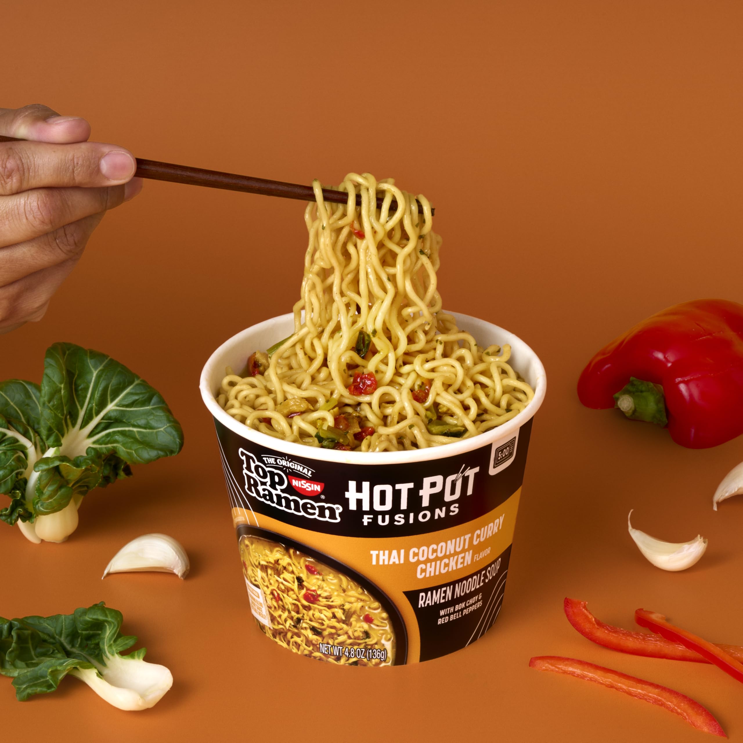 NISSIN Top Ramen Hot Pot Fusion with bok choy and peppers in a bowl