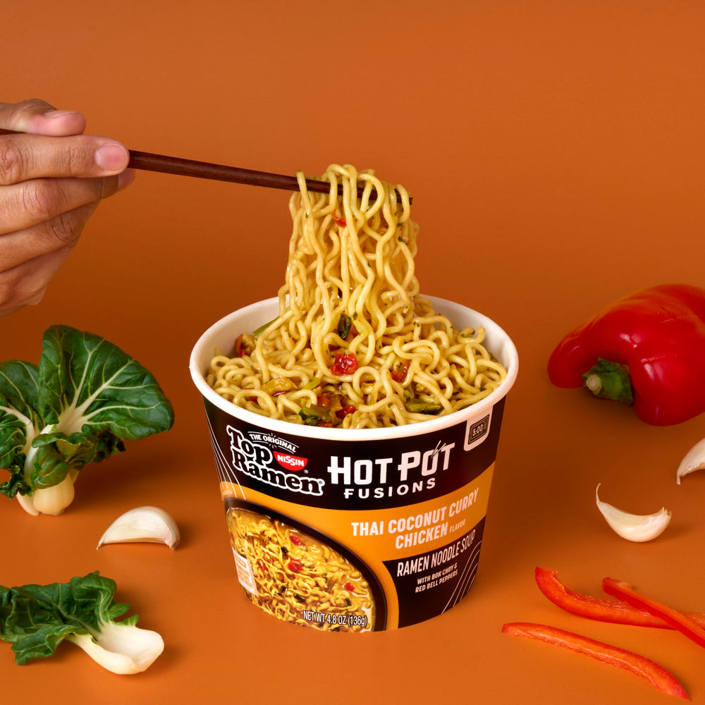 NISSIN Top Ramen Hot Pot Fusion with bok choy and peppers in a bowl