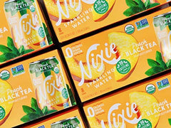 Nixie ingredients image featuring peaches and tea leaves for natural flavor