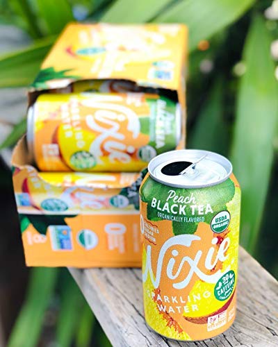 Nixie lifestyle shot with can on desk for everyday refreshment
