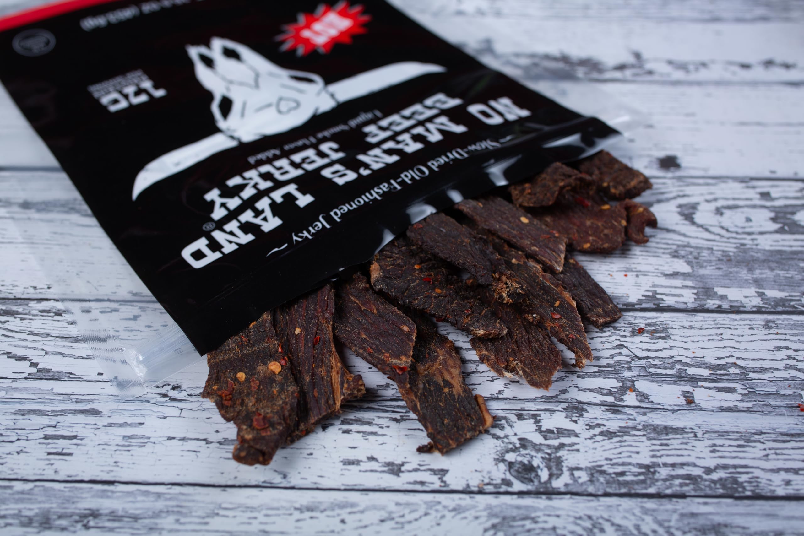 No Mans Land jerky nutrition close-up shows lean protein and low sugar.