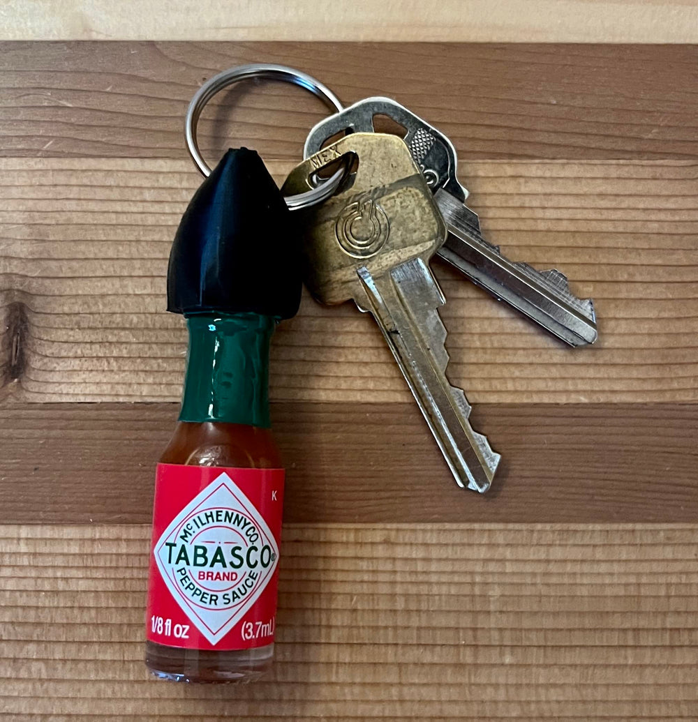 Nomad Enterprises mini Tabasco bottle on keychain for portable flavor on the go