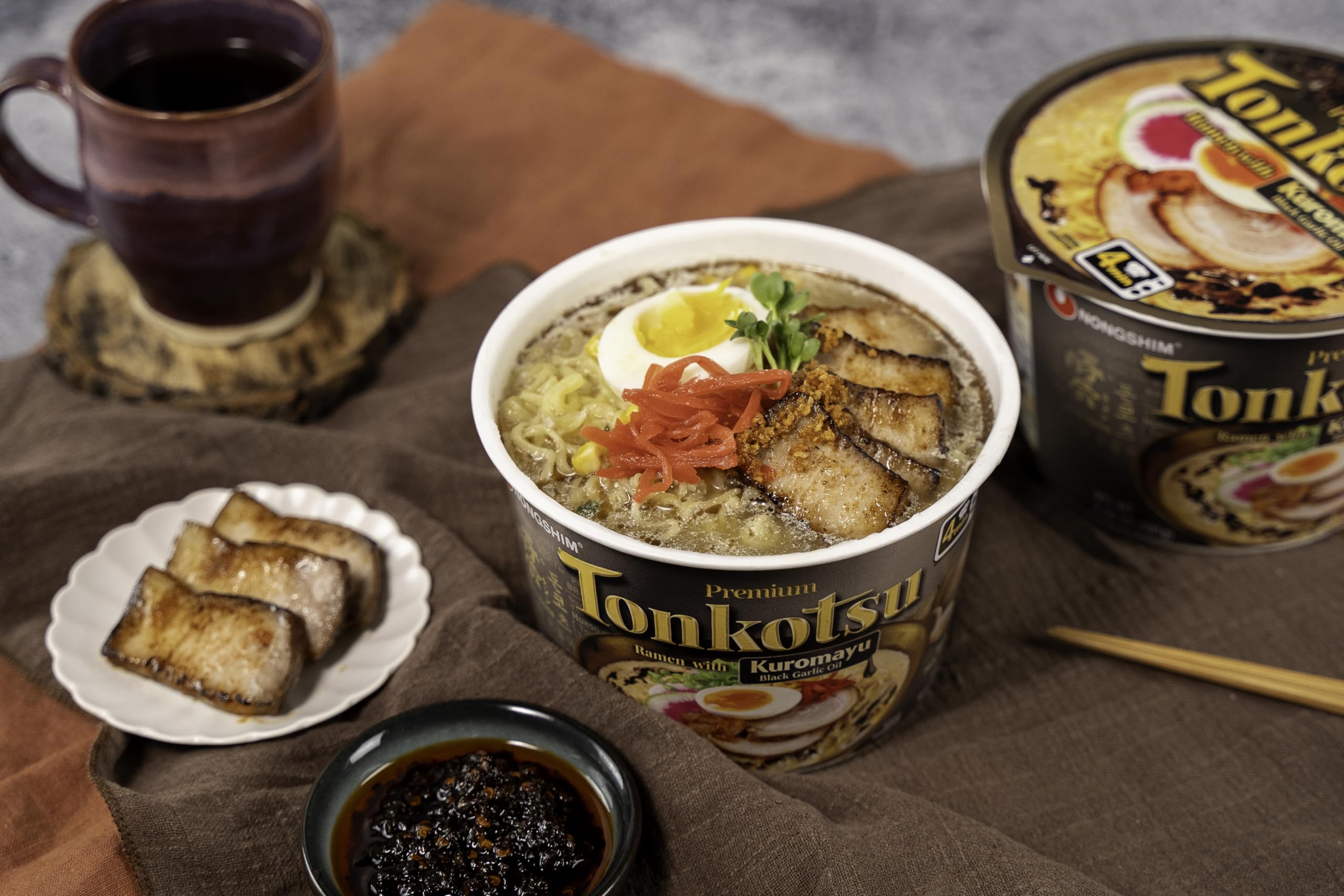 Nongshim tonkotsu broth swirl and noodles close-up.