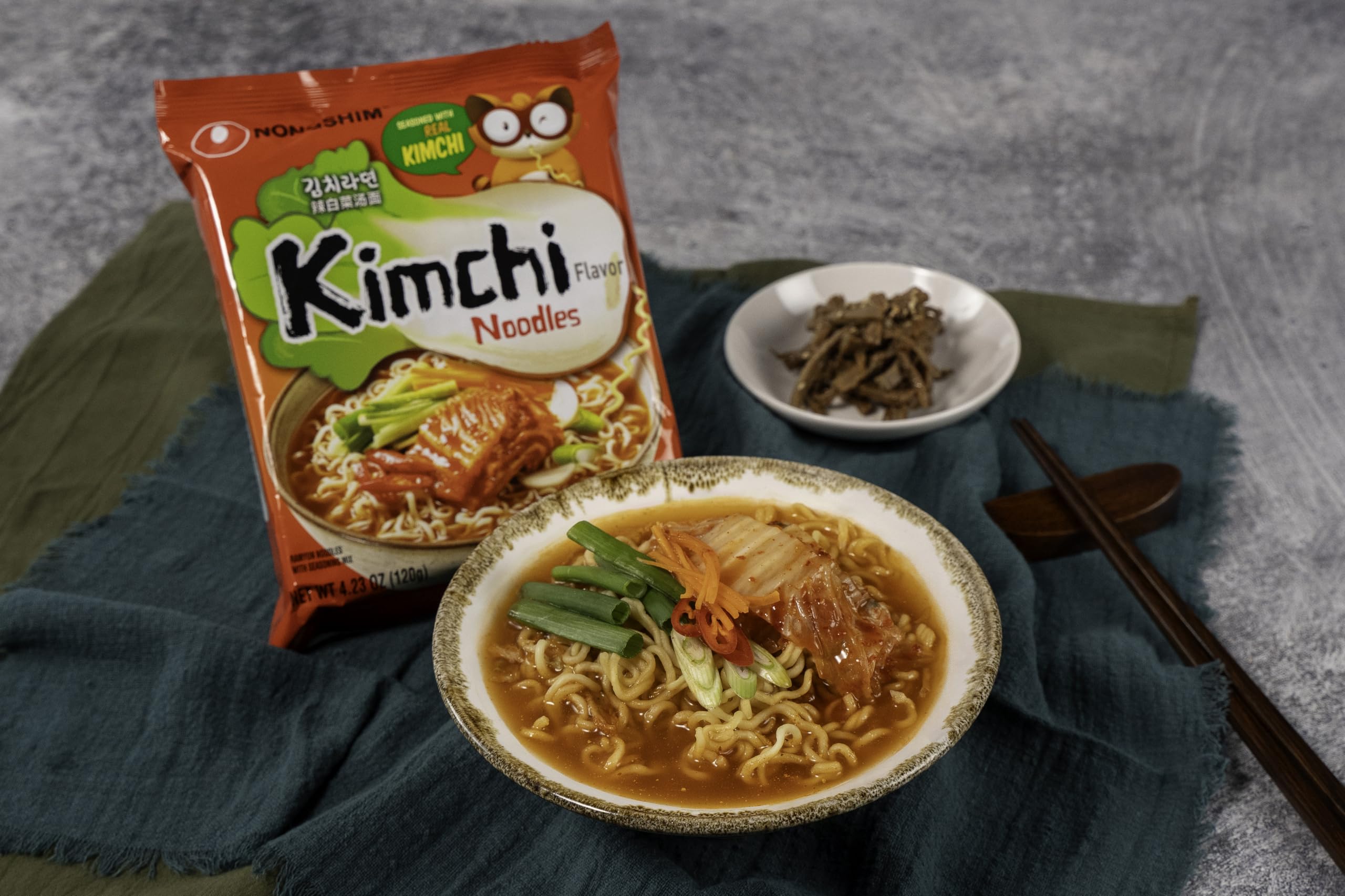 Nongshim ramen being poured into a bowl for a quick dinner.