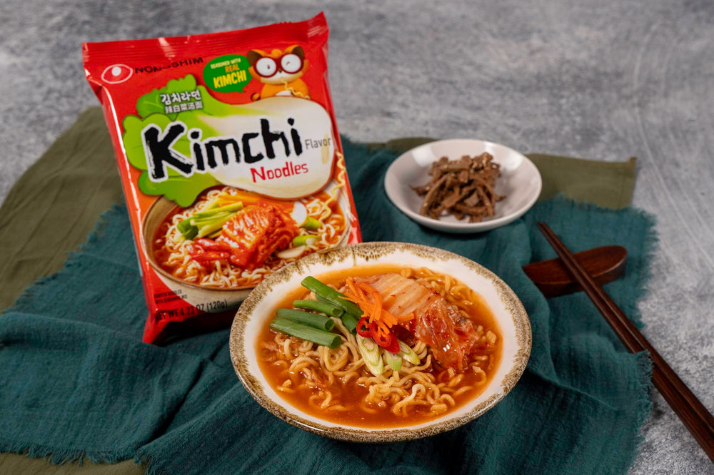 Nongshim ramen being poured into a bowl for a quick dinner.