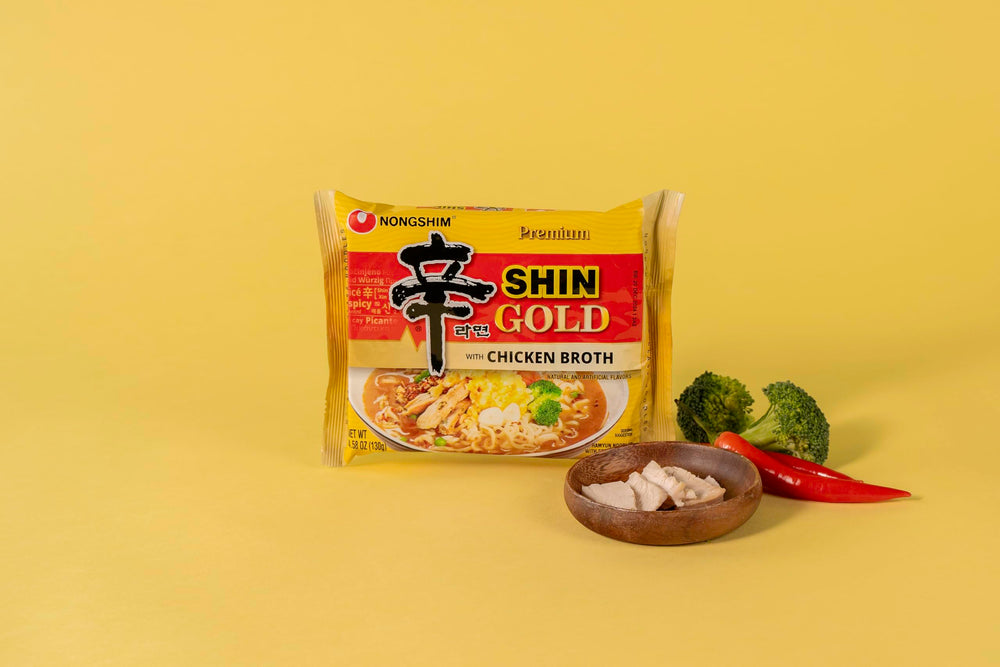 Nongshim Shin Gold serving-bowl scene showcases a hot, inviting ramen.