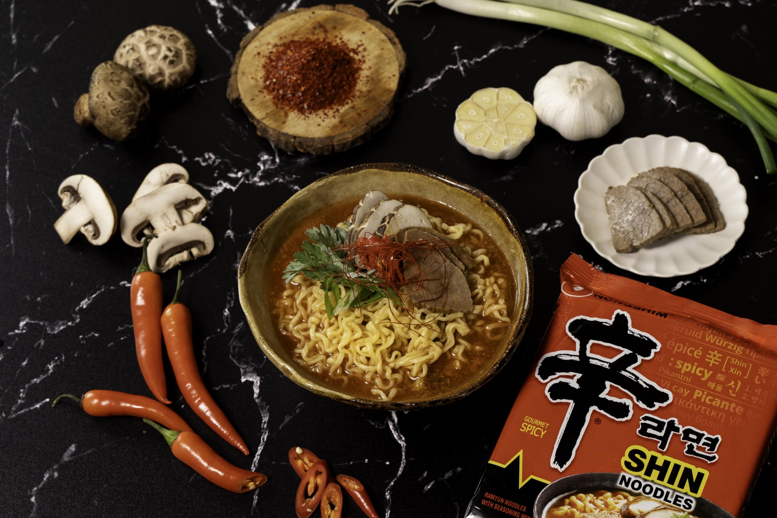 Enjoy a customizable bowl by adding kimchi, cheese, or extra noodles.