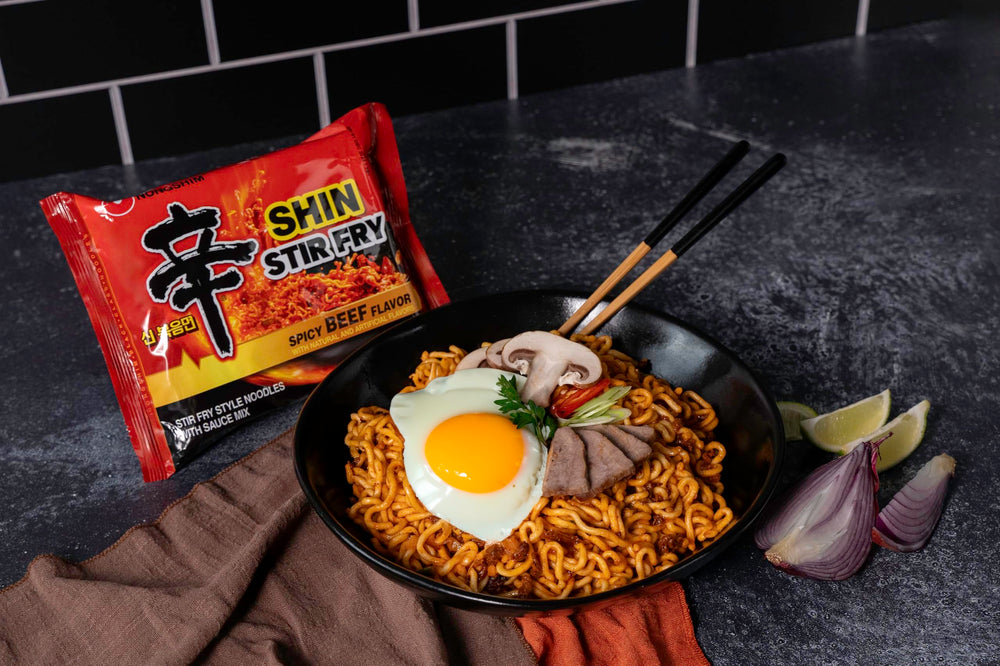 Nongshim Shin Ramyun Stir-Fry Square Bowl steaming, inviting ready-to-eat meal for quick gratification.