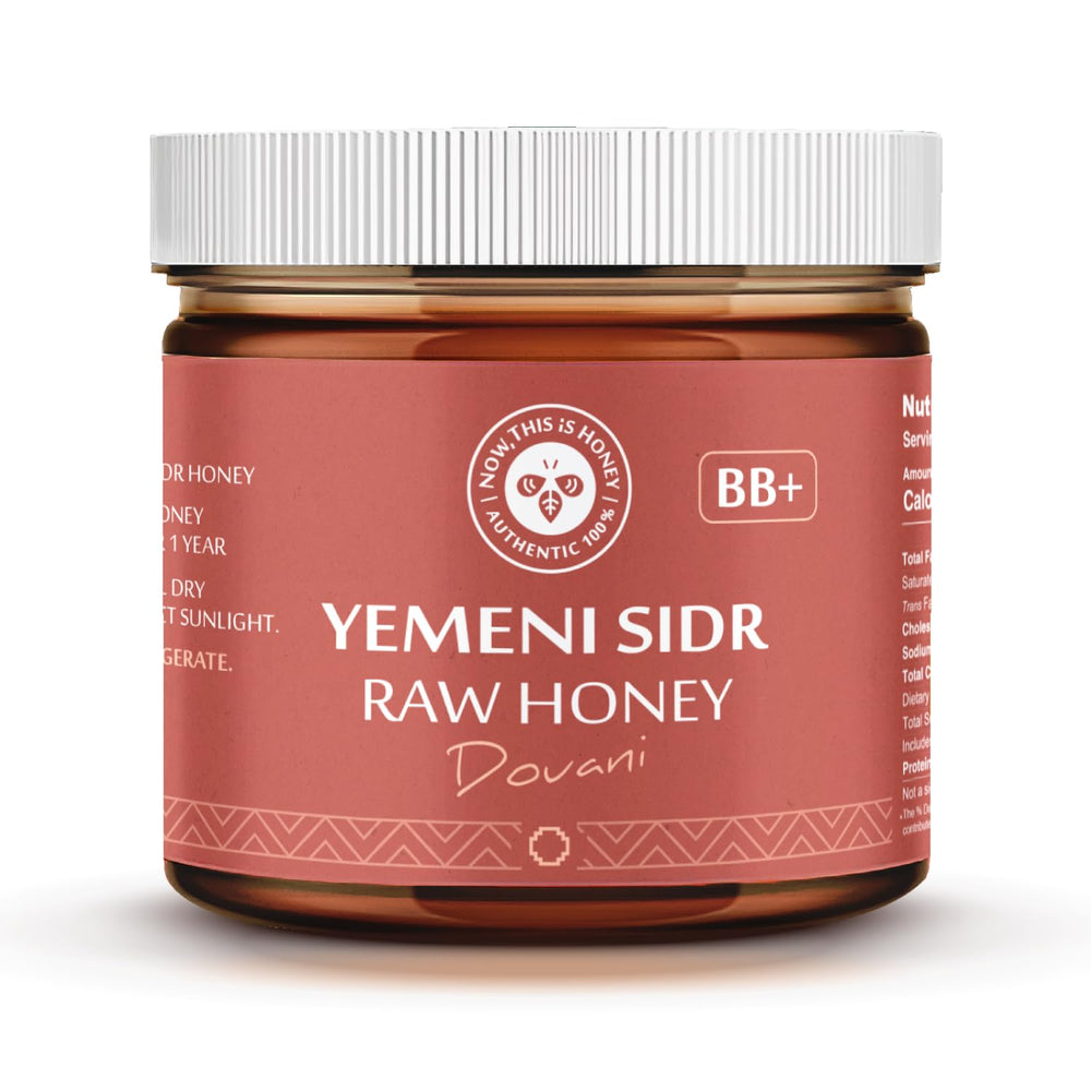 Now This Is Honey Glass jar on wood table signals premium packaging.