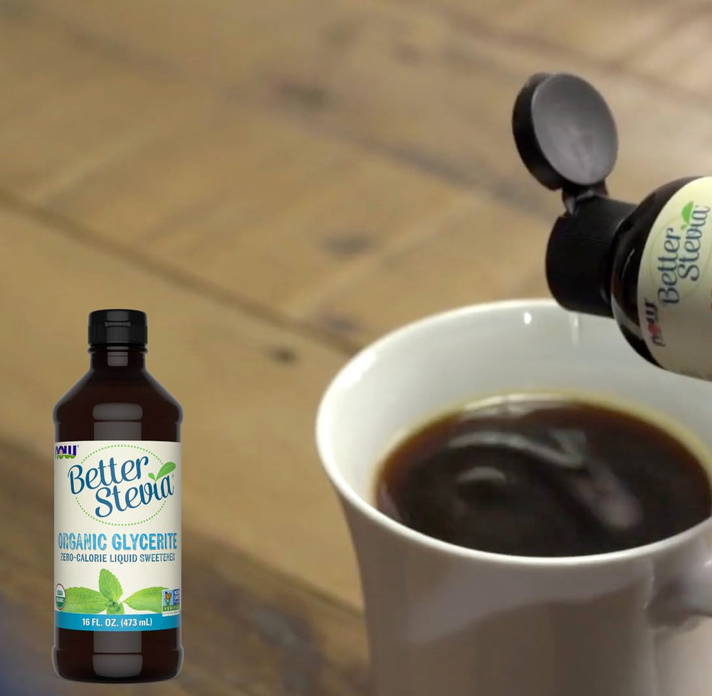 NOW Foods BetterStevia Liquid drops on a spoon, ideal for coffee or oatmeal.
