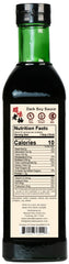 Pouring NPG Premium Dark Soy Sauce over ingredients to glaze a stir-fry.