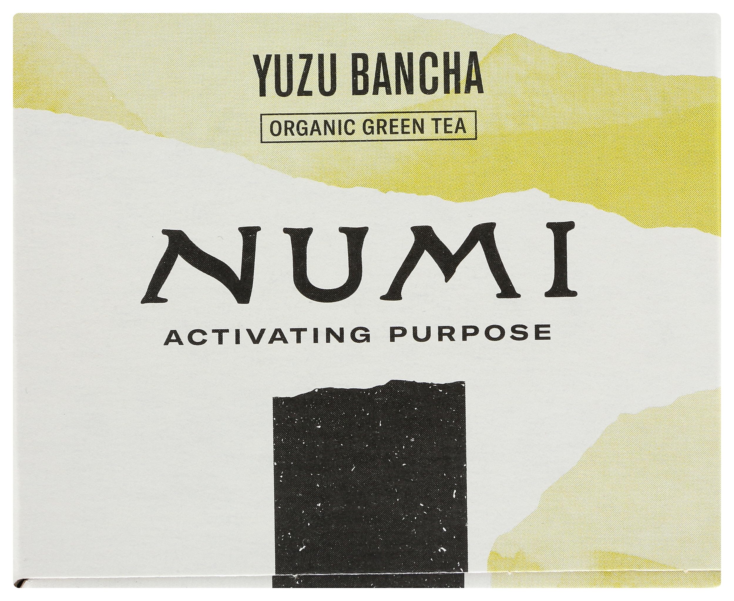 Numi Organic Yuzu Bancha Tea label closeup emphasizes organic ingredients and certifications.