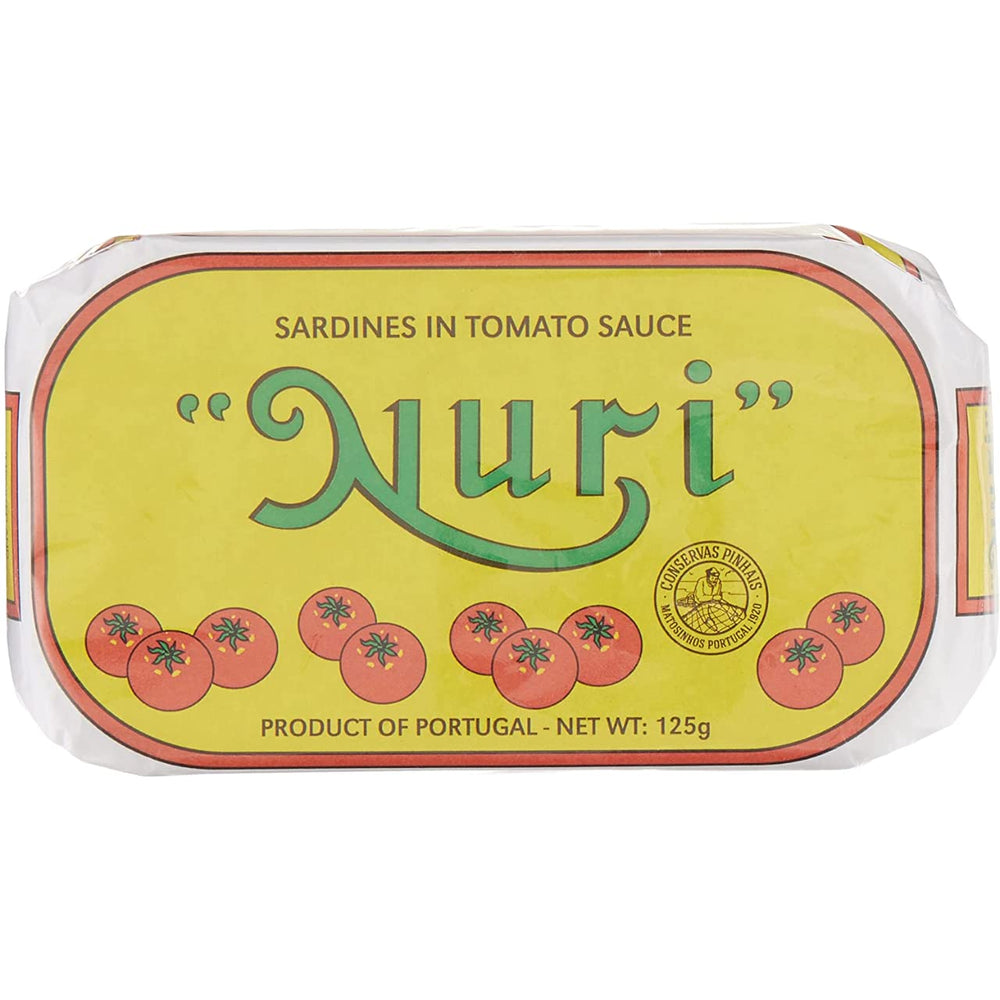 Nuri sardines in tomato sauce opened, plated for a simple meal.