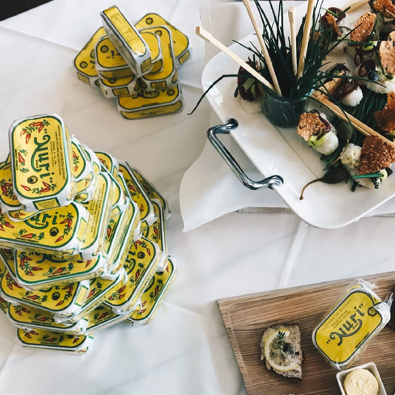 Nuri sardines in olive oil can paired with lemon and herbs.