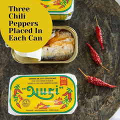 Nuri sardines served on a plate with extra spicy olive oil, perfect for speedy lunches.