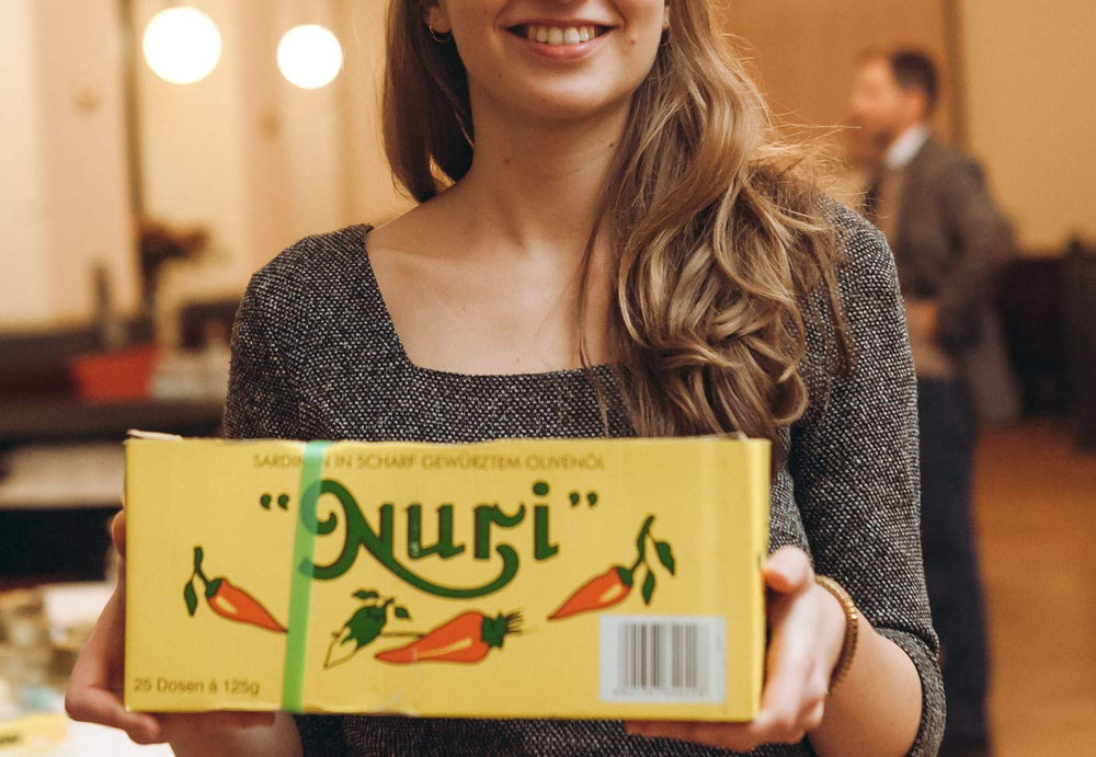 Gift packaging presents Nuri sardines as a luxurious culinary gift.